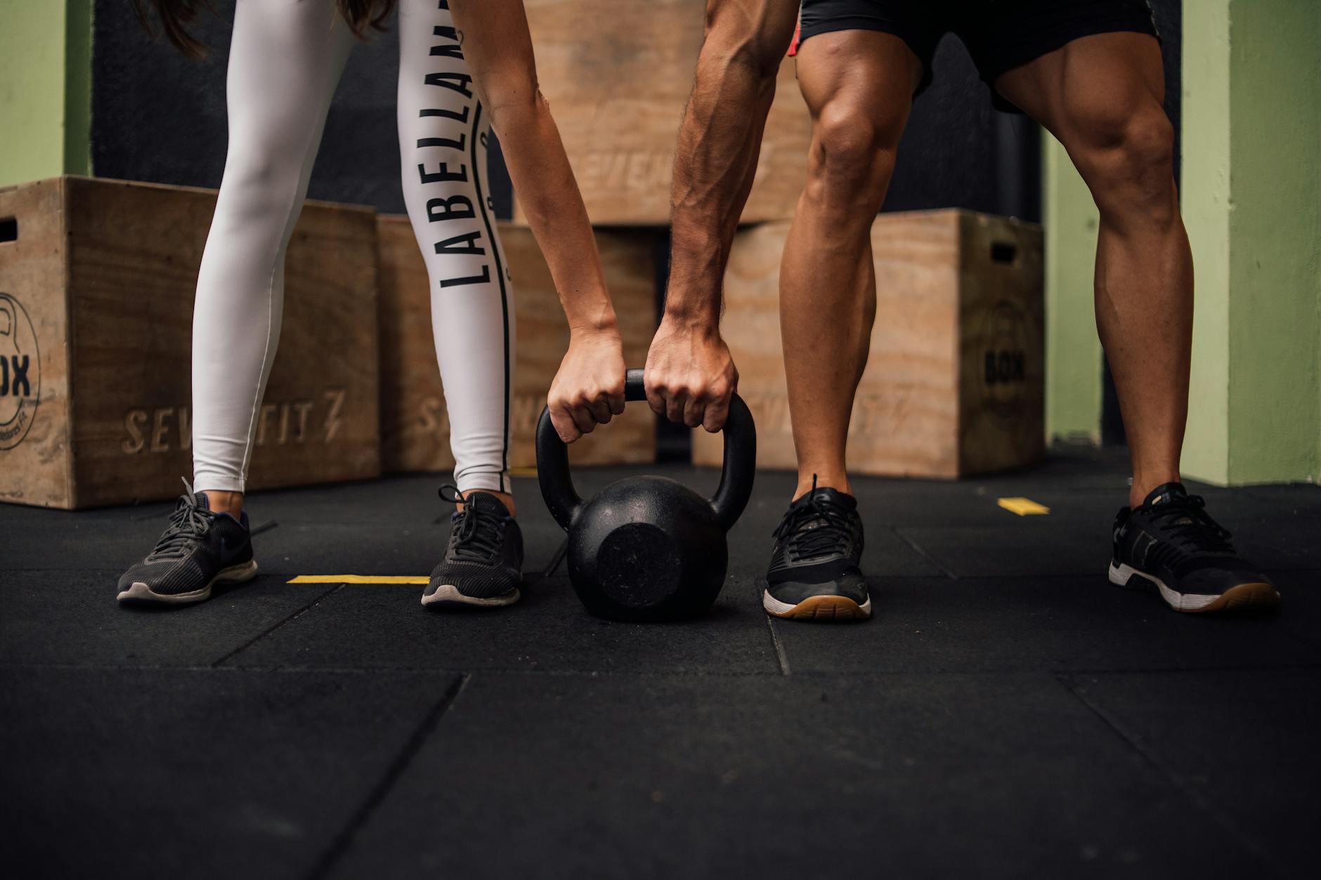 man and woman on crossfit training