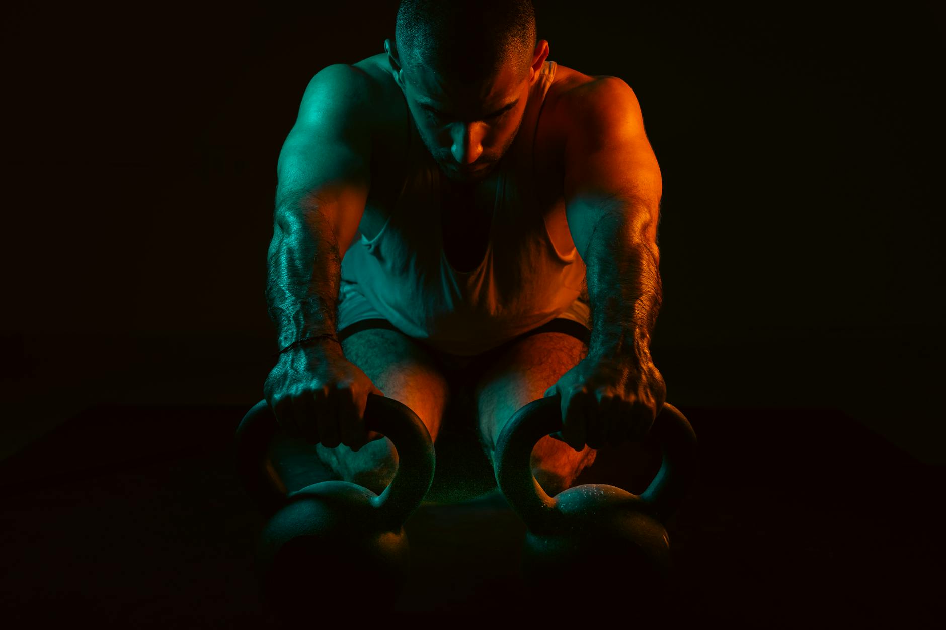 intense kettlebell workout in low light