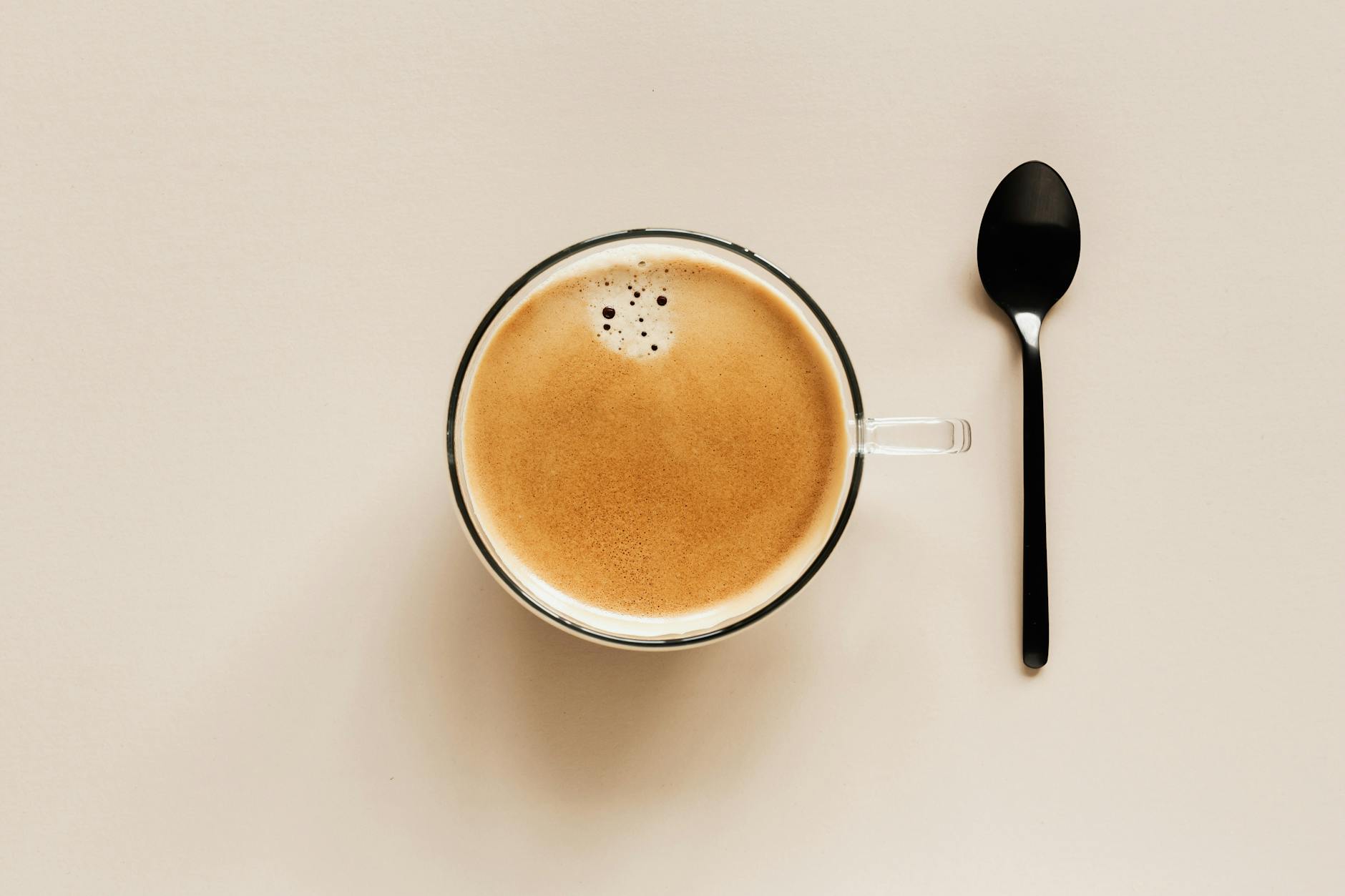 cup of coffee and spoon of table