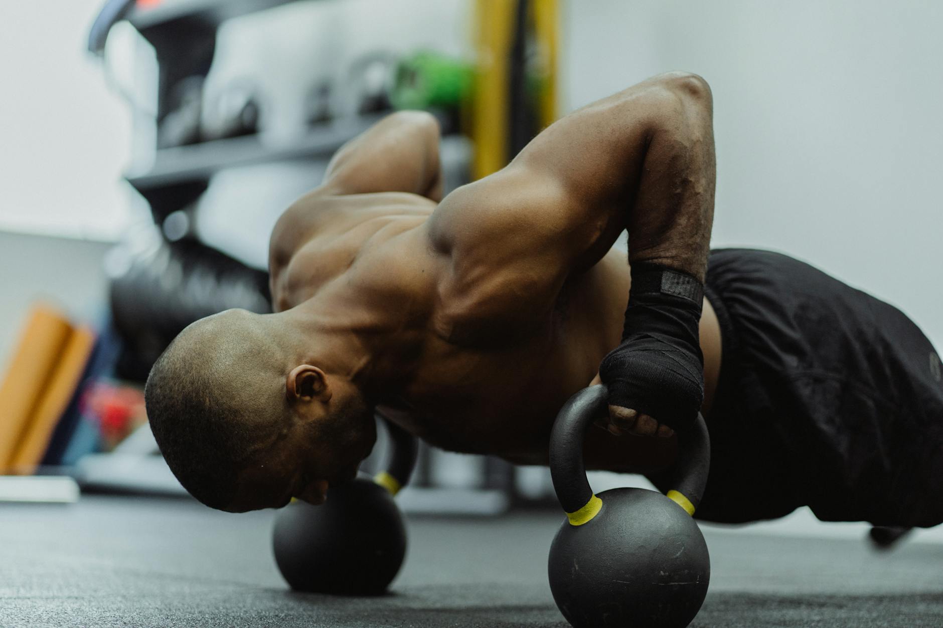 man doing kettle bell push up