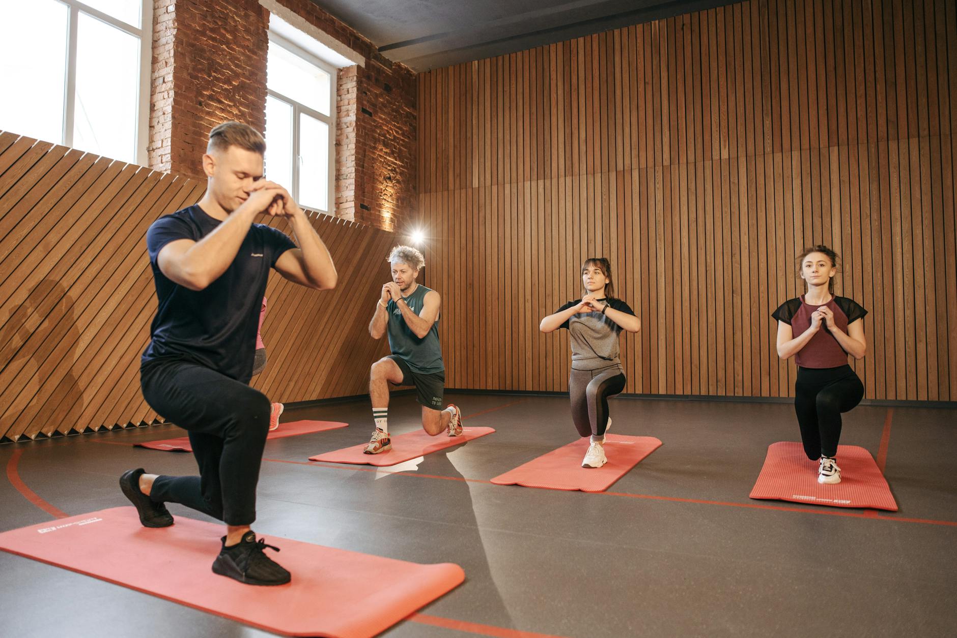 people practicing yoga inside the studio