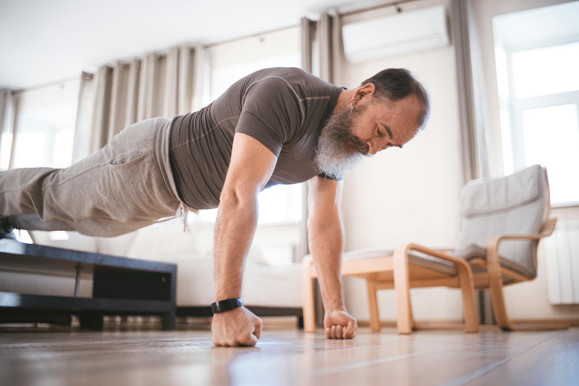 a man doing push up on the floor