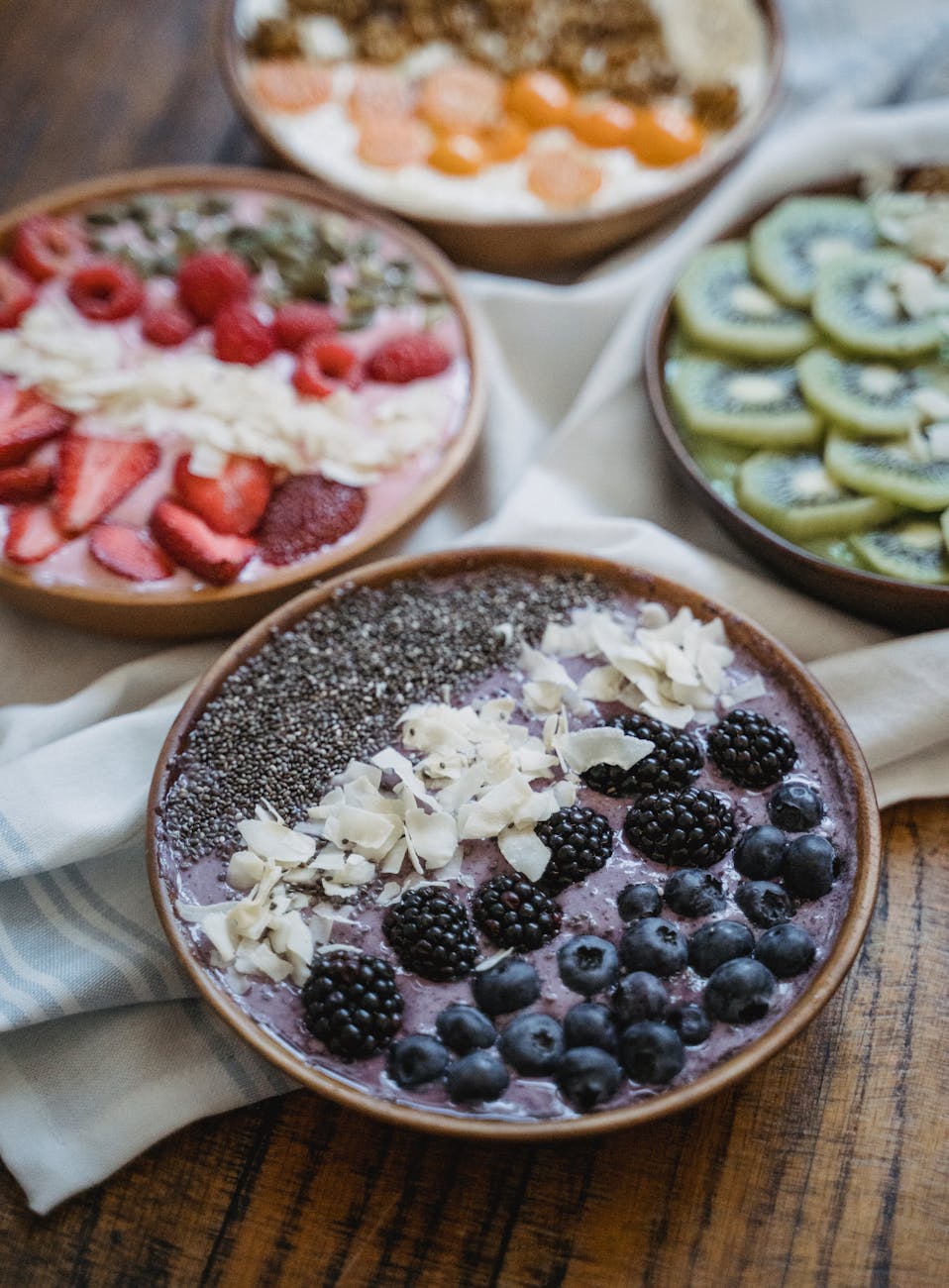 variety of healthy breakfast bowl on a wooden surface