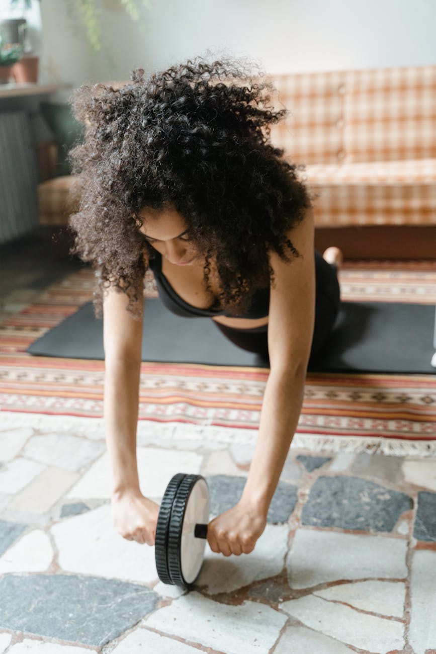 a woman using an ab roller