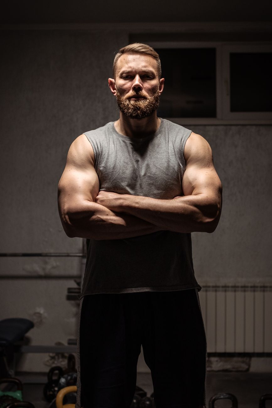 a brawny man in gray tank top shirt