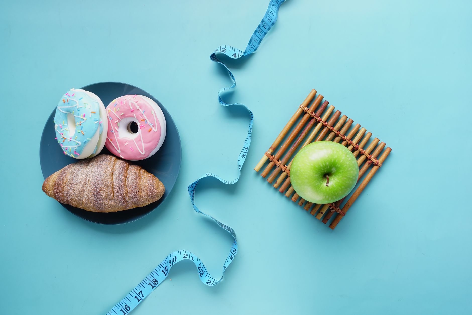 apple and doughnuts on table