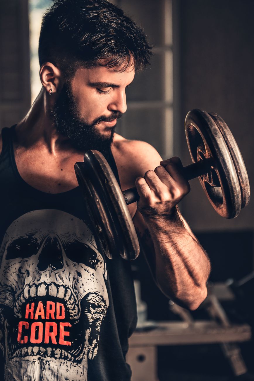 man holding dumbbell